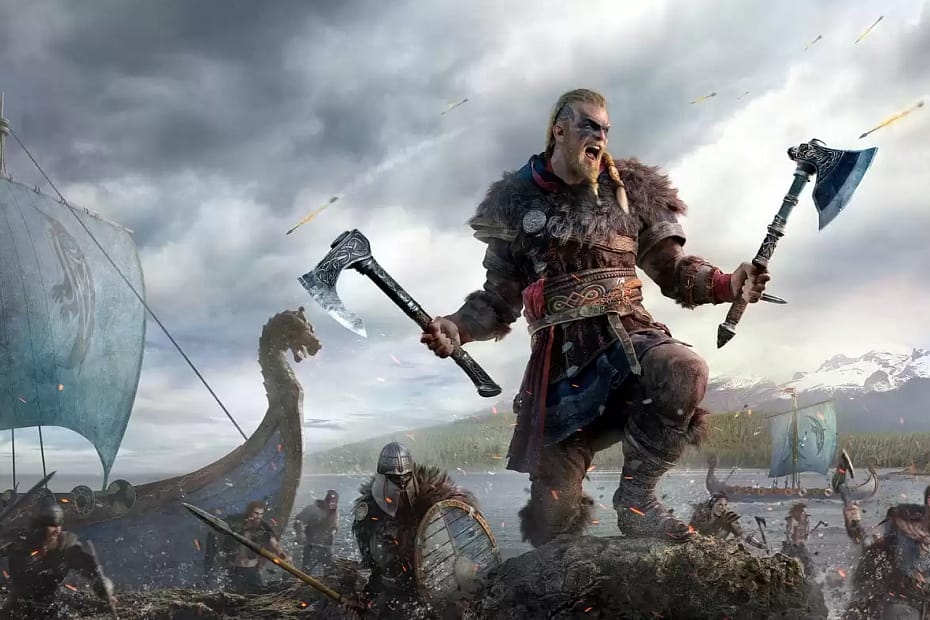 A bearded, tatttooed Viking with axes in with hands has steppd off a long-ship and is now standing one leg on a rock, snarling as fire arrows rain down from the sky and his compatriots in the background run onto the shore to join his fight.